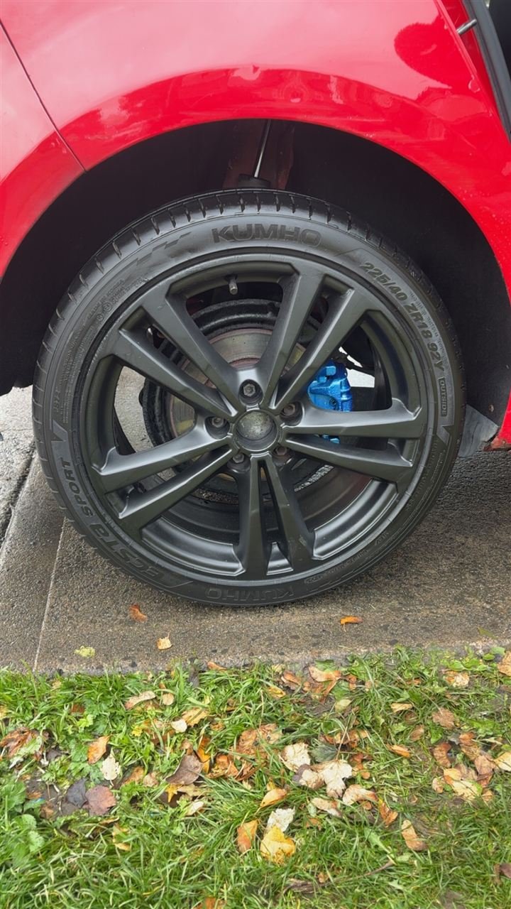 The same wheel with the brake caliper painted gloss blue
