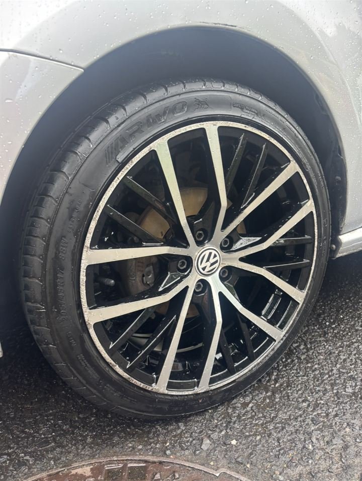 Silver Volkswagen with diamond-cut alloy and unpainted brake caliper before painting